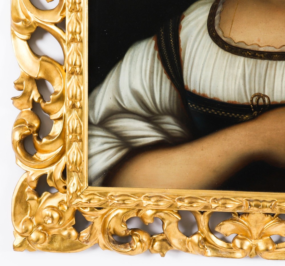 An early 19th-century portrait oil painting of a woman in classical attire set within a heavily carved gold giltwood frame. View VIII