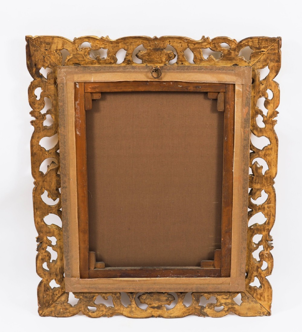 An early 19th-century portrait oil painting of a woman in classical attire set within a heavily carved gold giltwood frame. View IX