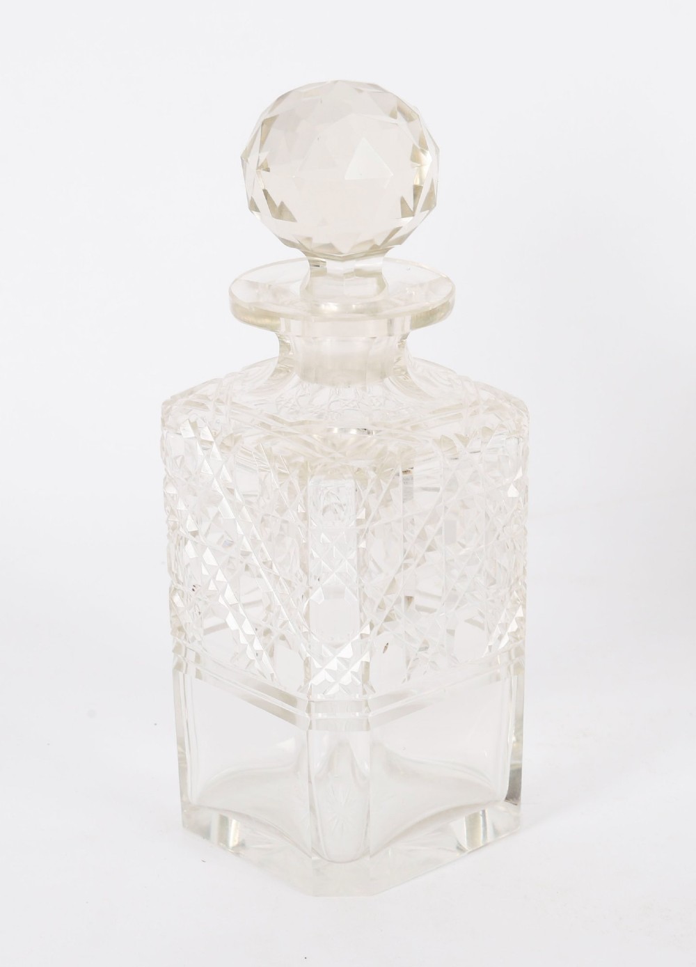 A 19th-century Victorian figured oak three-bottle tantalus open to reveal three cut glass decanters, a fitted cribbage board, and a drop-front drawer containing a silver-plated tray and playing cards. View XIV