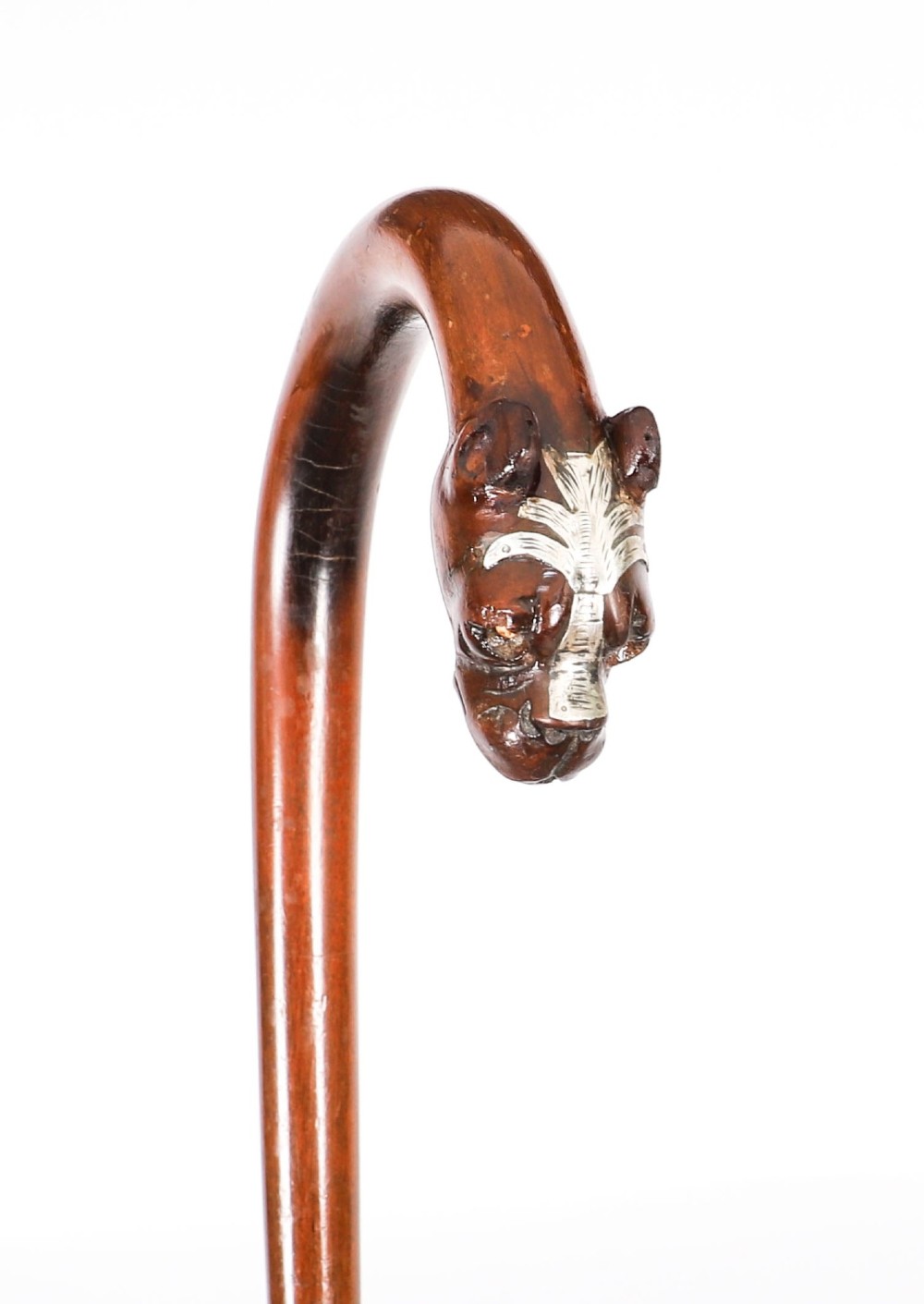 An antique dark wood walking stick featuring a curved crook handle carved into the detailed head of a boxer dog. View III