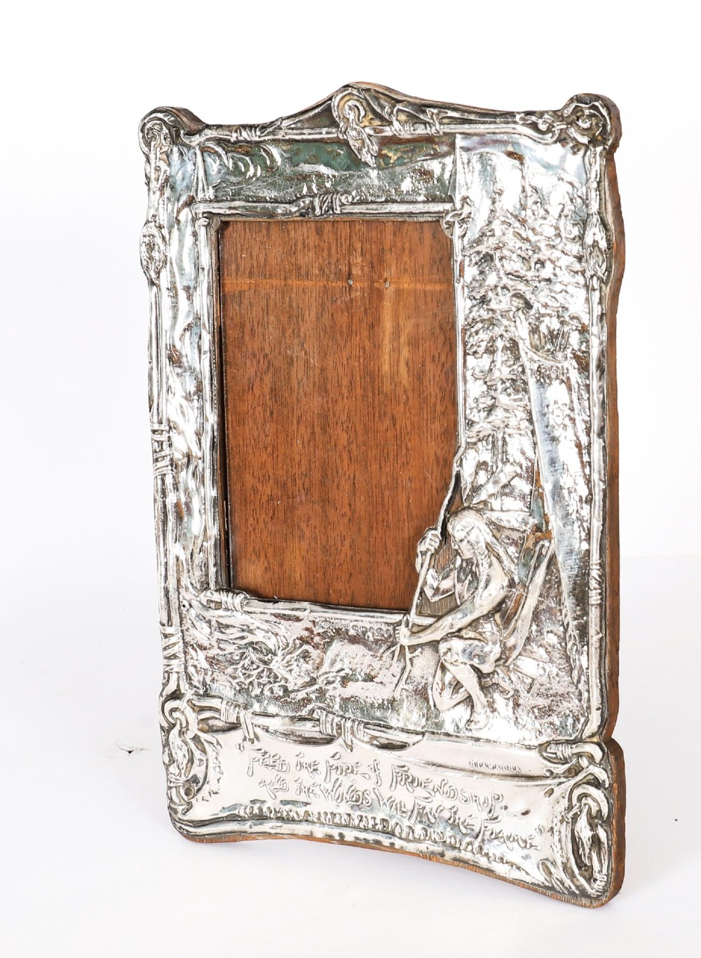 An Edwardian sterling silver picture frame featuring an embossed relief scene of Hiawatha with a wooden backing. View II