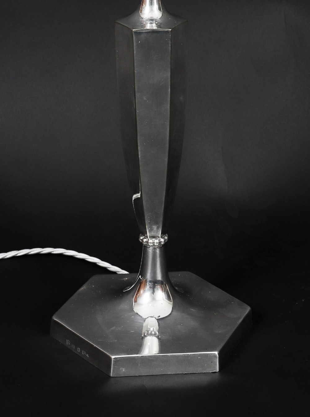 An Art Deco silver-plated twin-arm table lamp with a faceted stem and hexagonal base. View VII