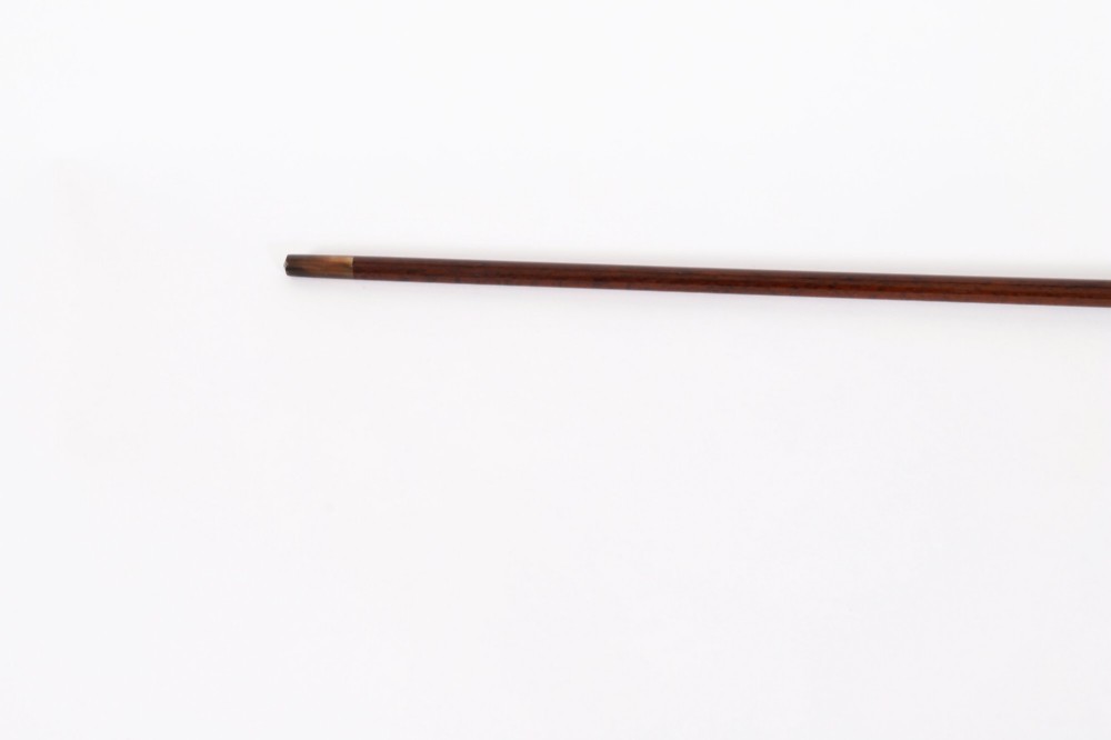 An antique walking stick featuring a spherical pink quartz pommel set above a white enamel collar with silver beaded borders and a dark wood shaft. View IV