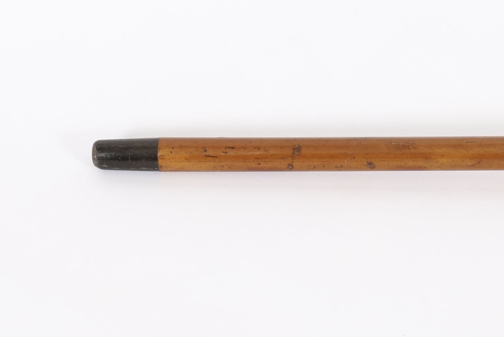 Victorian walking cane featuring an engraved sterling silver pommel with spiralled fluting mounted on a light wood shaft. View VIII