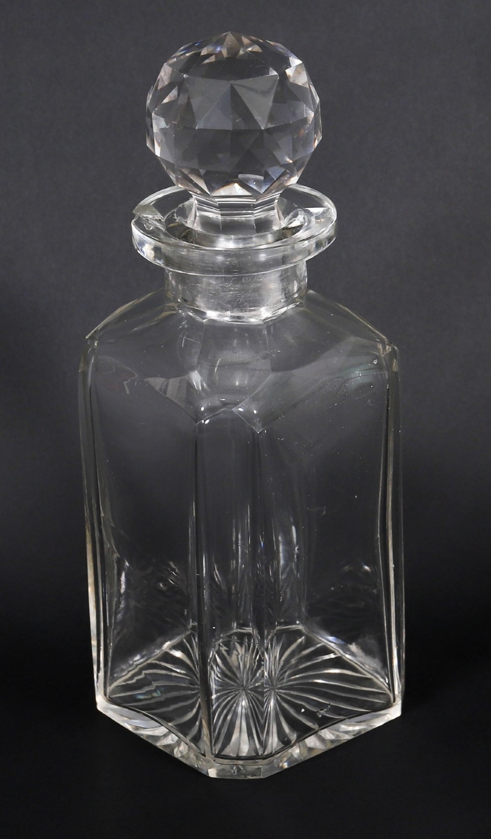 An open and closed 19th-century Victorian burr walnut tantalus box containing three cut crystal decanters, brass-mounted liqueur glasses, and a deep blue velvet lining. View XII