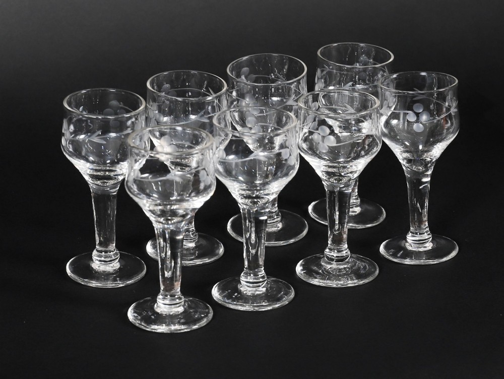 An open and closed 19th-century Victorian burr walnut tantalus box containing three cut crystal decanters, brass-mounted liqueur glasses, and a deep blue velvet lining. View XIII