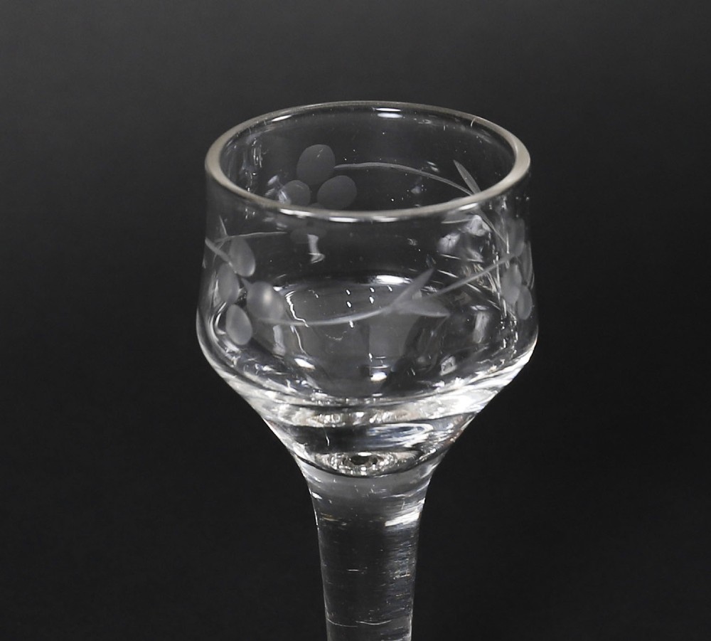 An open and closed 19th-century Victorian burr walnut tantalus box containing three cut crystal decanters, brass-mounted liqueur glasses, and a deep blue velvet lining. View XIV