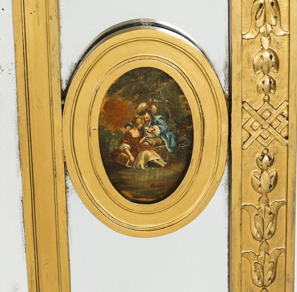 An antique French giltwood trumeau mirror with a painted pastoral scene top panel, carved shell cresting, and three glass mirror sections. View VIII