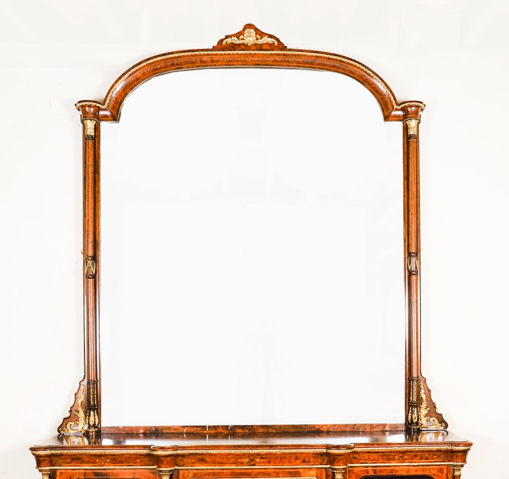 A nineteenth-century Victorian burr walnut credenza featuring an arched mirror back, glazed side doors, and a central cupboard inlaid with a porcelain plaque. View III