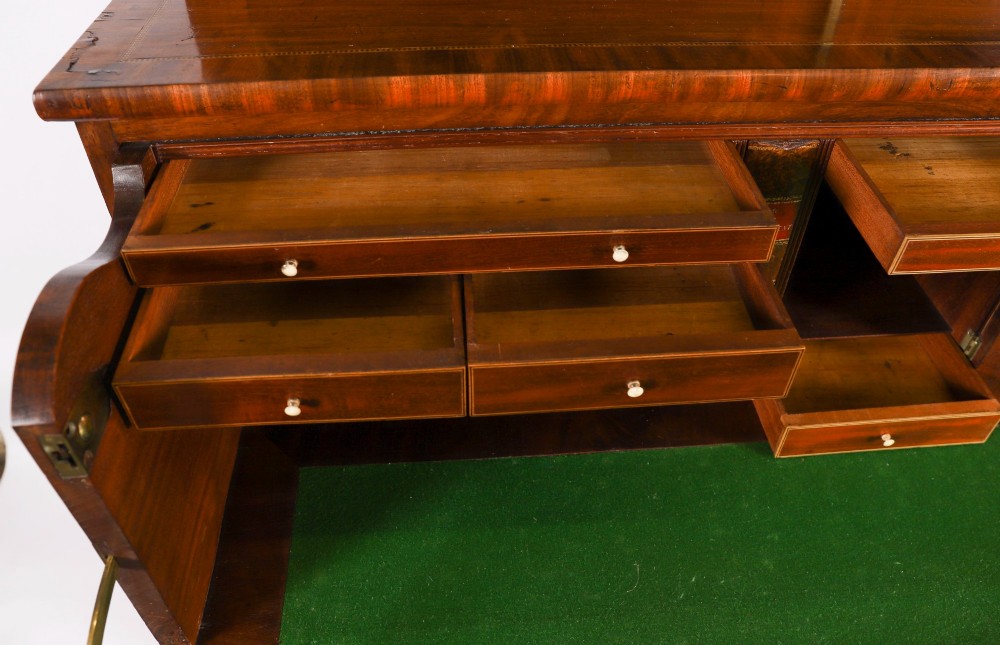 An antique George III flame mahogany secretaire bookcase featuring a shaped pediment, two upper astragal glazed doors, and a lower four-drawer chest base with brass ring handles. View XV