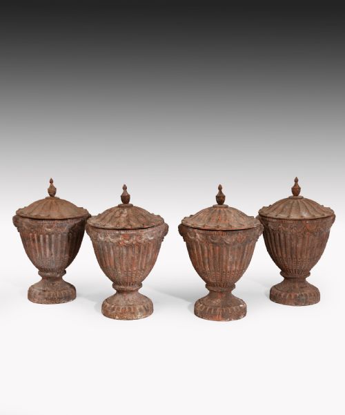 Set of Four Nineteenth Century Cast Iron Garden Urns.