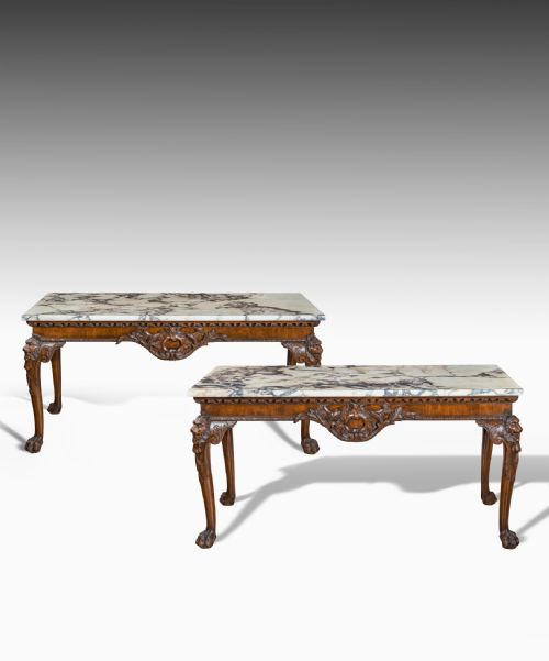 fig 1. Pair of George II style carved mahogany console tables.