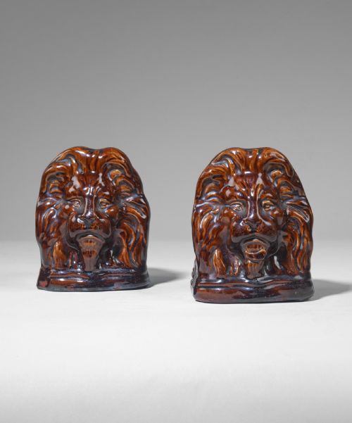Pair of Mid Nineteenth Century Ceramic Lion Sash Stops