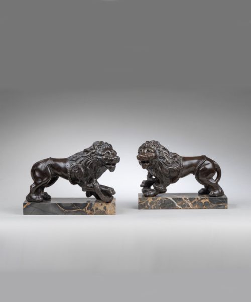Pair of Cast Iron Lion and Serpent Sculptures