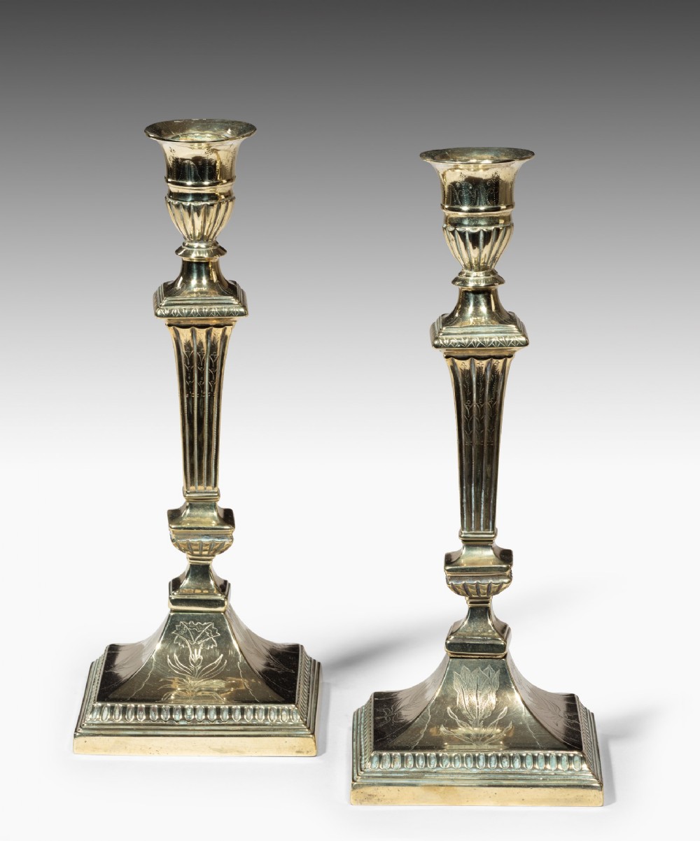 Pair of Irish Georgian engraved brass candlesticks