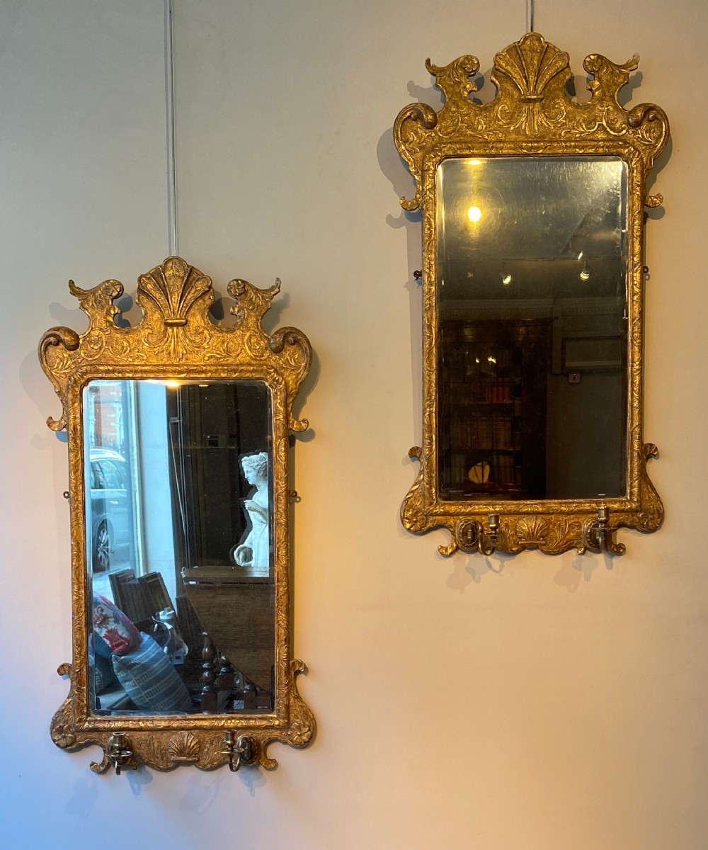 Pair of Georgian carved giltwood mirrors
