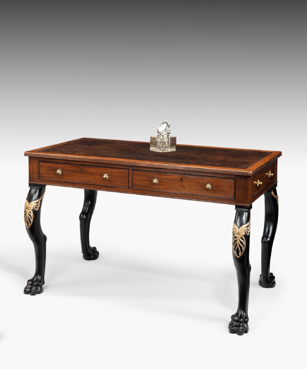 Regency mahogany writing table with carved monopodia legs