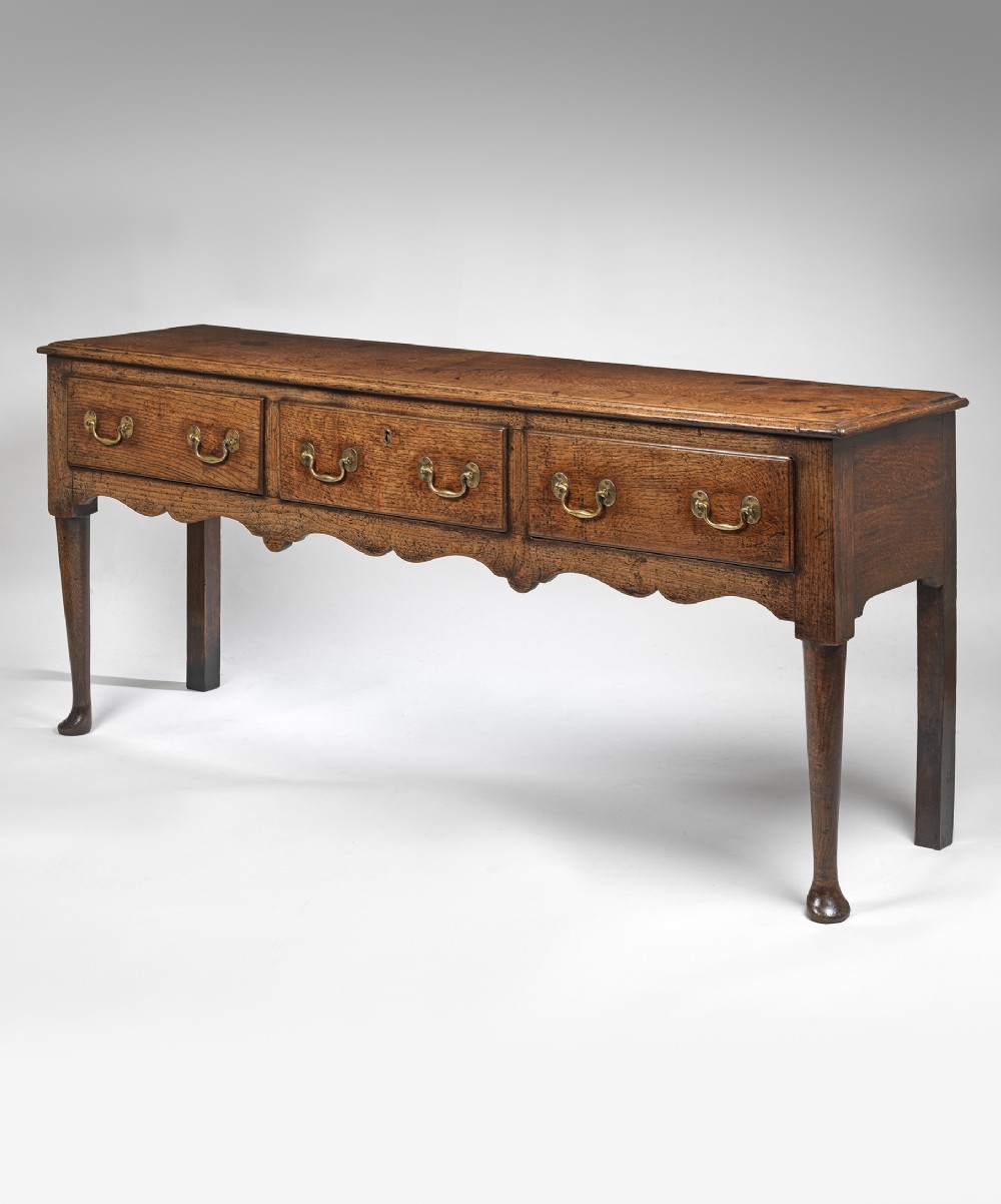 Georgian oak dresser base with padfeet