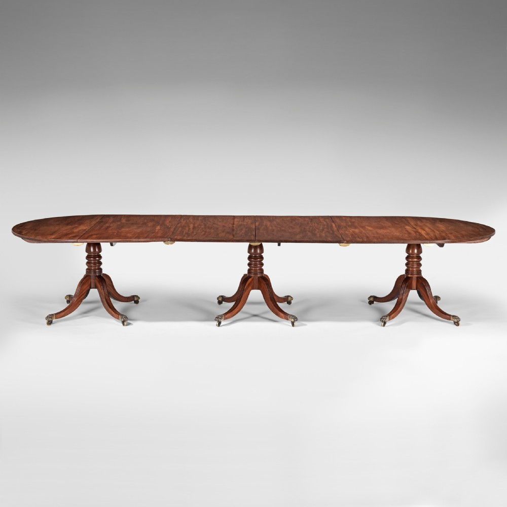 Large Georgian three pillar mahogany dining table View II