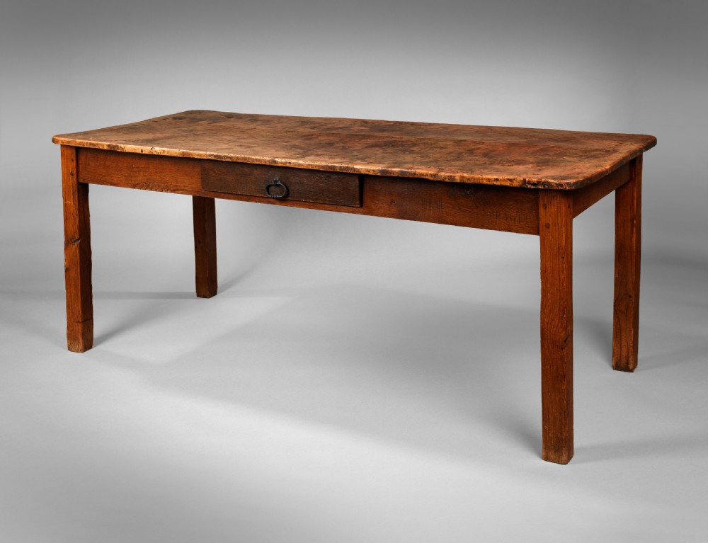 A Nineteenth Century vernacular burr elm farmhouse kitchen table
