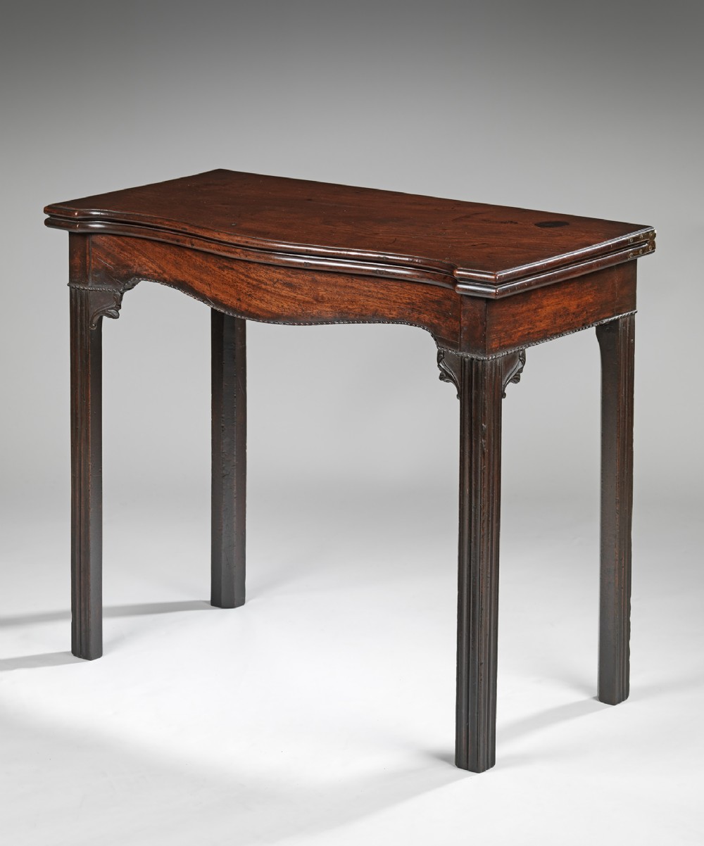 Chippendale carved mahogany serpentine tea table