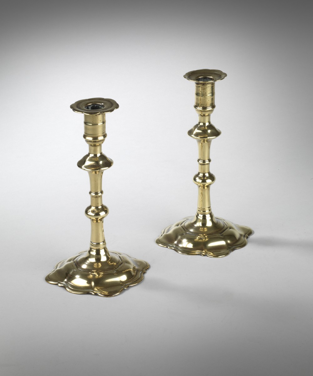 Pair of Georgian petal base brass candlesticks