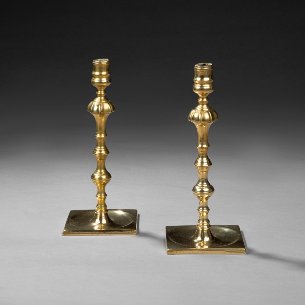 Pair of George II brass silverform candlesticks