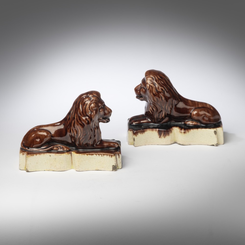 Pair of Nineteenth Century ceramic treacle glazed lions