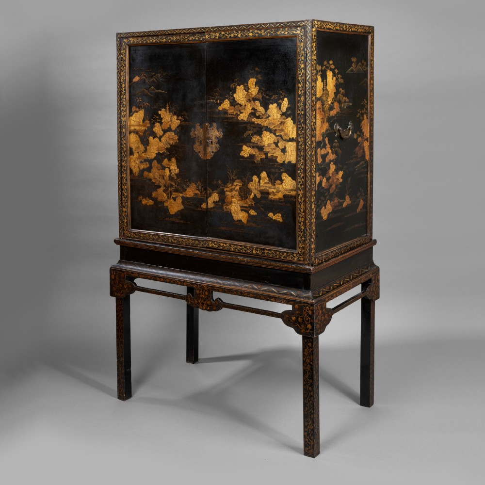 A 19th-century Chinese black lacquer cabinet decorated with intricate gilt landscapes, mounted on a matching tall table stand. View III