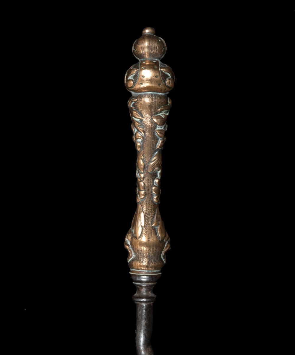 A three-piece set of nineteenth-century fire irons featuring ornate cast brass handles, spiral-twisted steel shafts, and a pierced pan shovel. View II