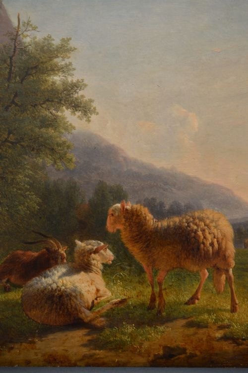 An antique oil painting depicting sheep and a goat in a green pastoral landscape surrounded by an ornate gold giltwood frame. View VIII