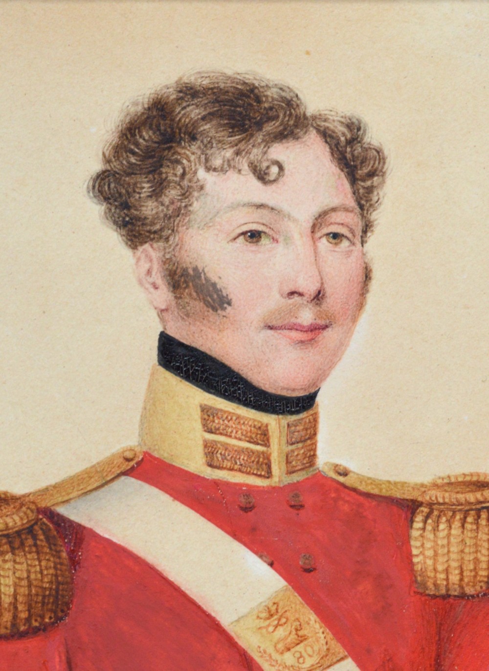 A 19th-century watercolour portrait of a British army officer in a red tunic with gold epaulettes, enclosed in a blue mount and giltwood frame. View III