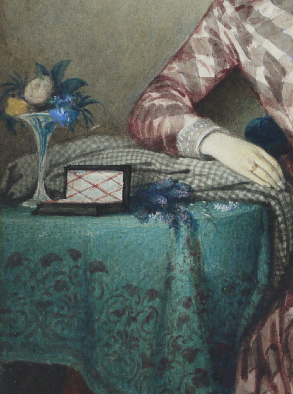 A watercolour portrait depicting a young woman in a checkered dress seated in a room beside a table covered with a teal cloth. View V
