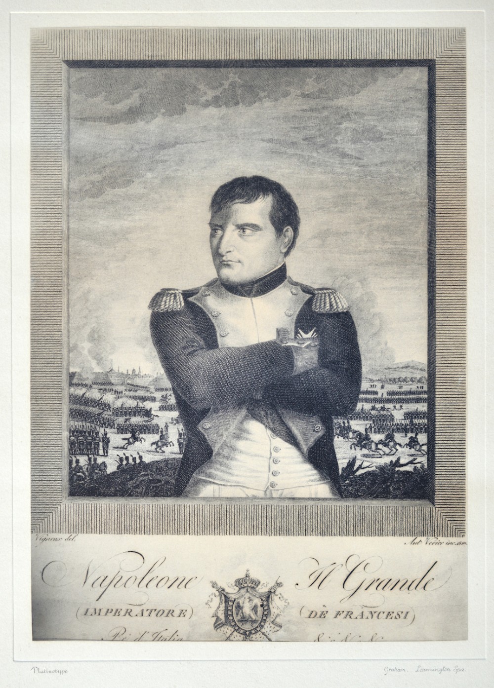A framed monochrome portrait print depicting Napoleon Bonaparte in military dress with crossed arms, housed within a cream mount and a dark ebonised reeded frame. View II
