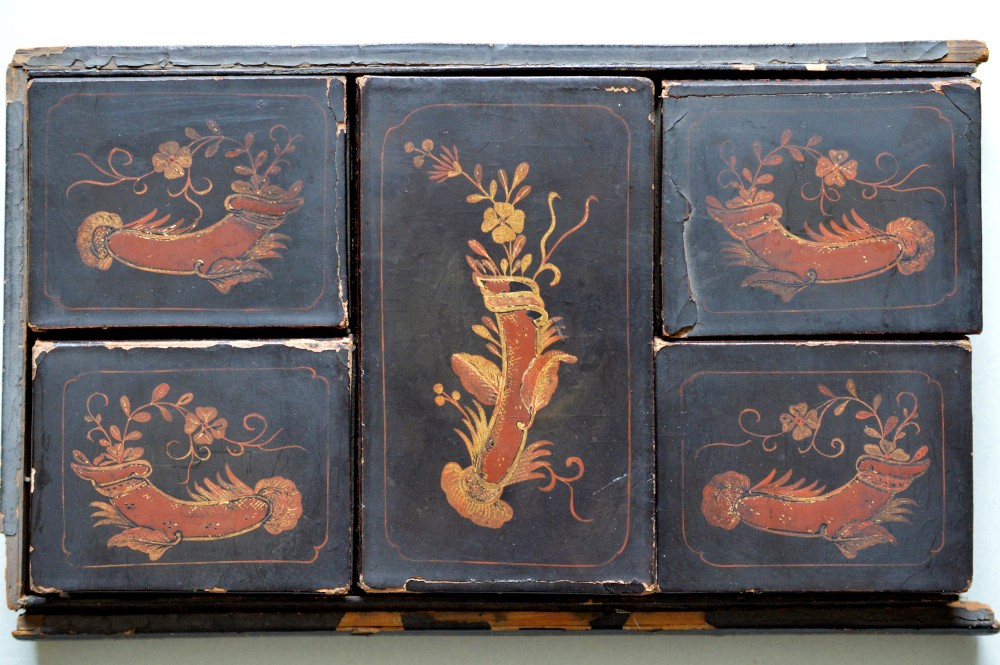A collection of 126 engraved Chinese mother of pearl gaming counters in round and rectangular shapes arranged inside a fitted wooden tray. View III