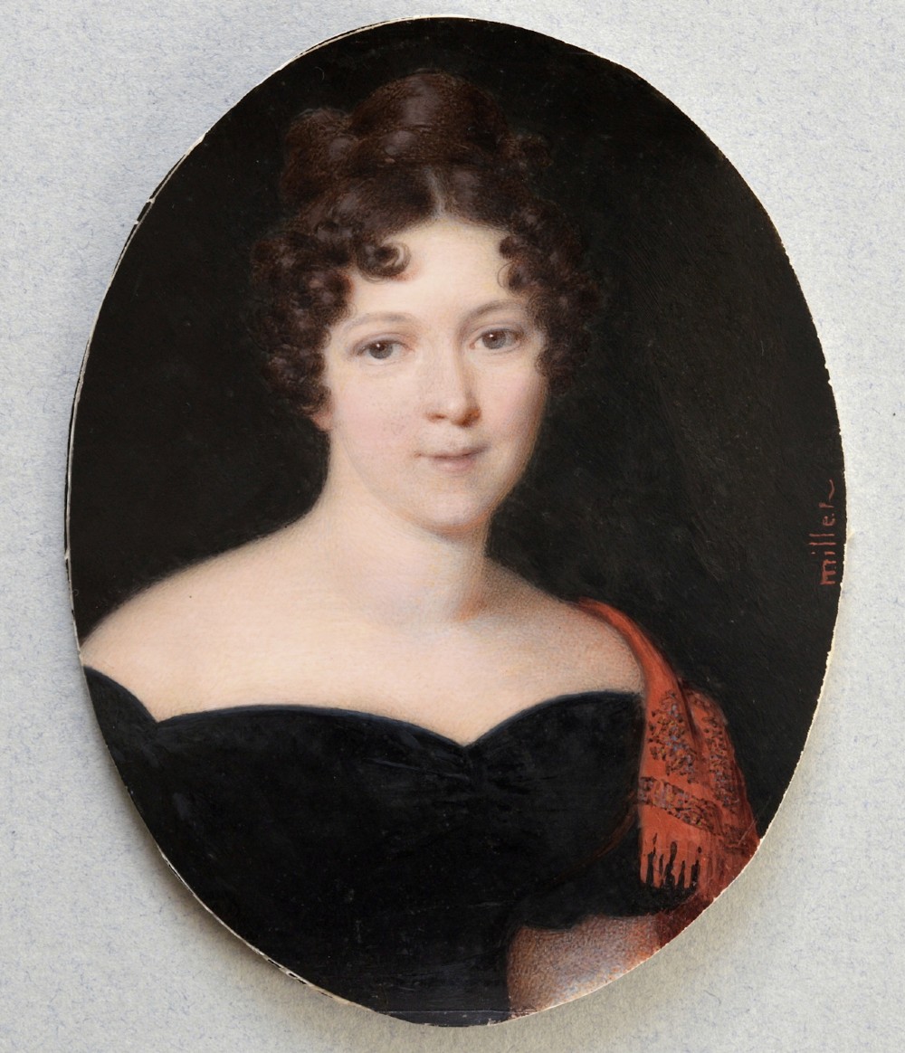 An oval portrait miniature painting depicting a woman with dark curly hair in a black off-the-shoulder dress, set in a beaded gilt brass bezel within a black frame. View III