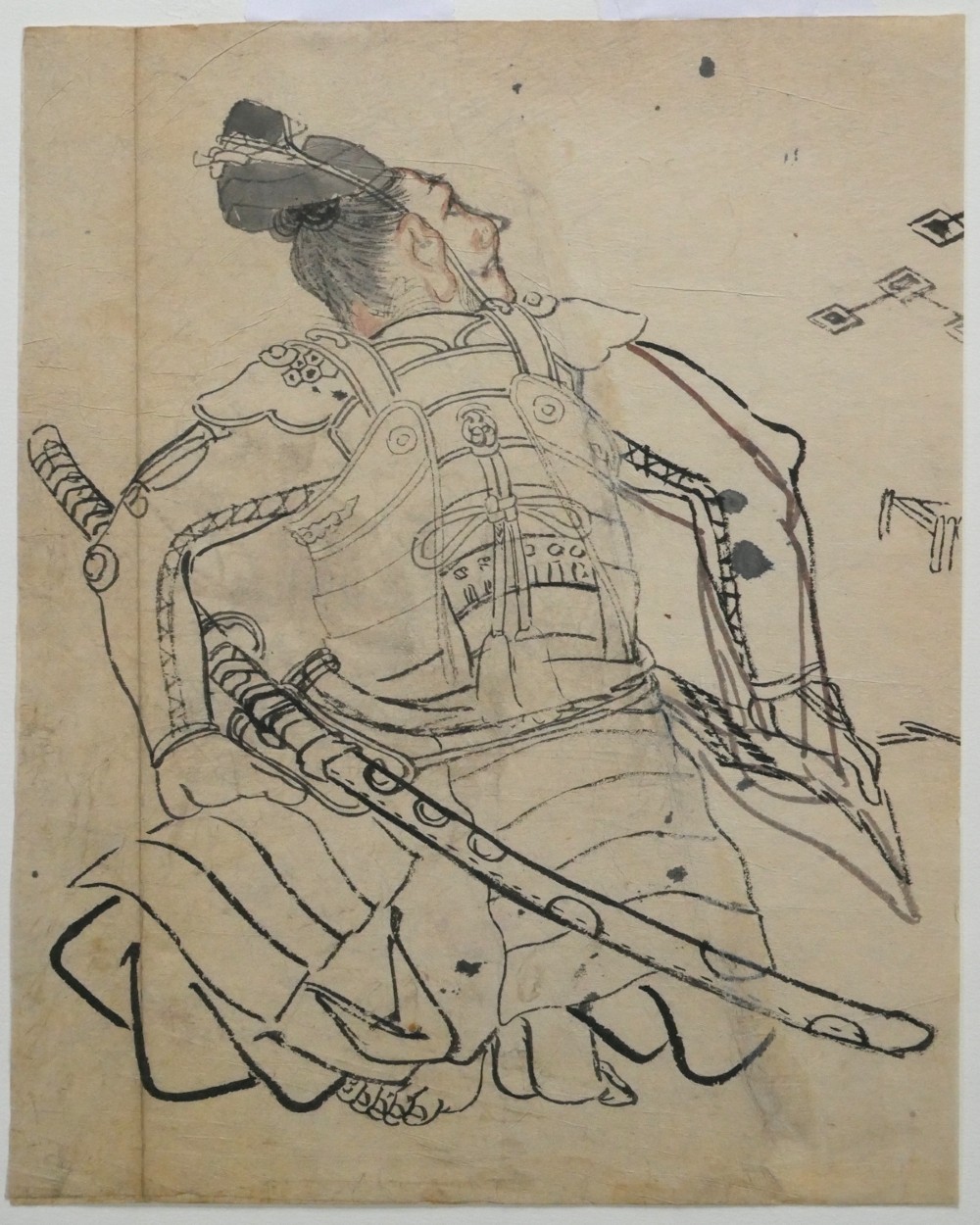 An antique Japanese ink drawing on aged paper depicting a seated samurai in detailed body armour looking upwards. View II