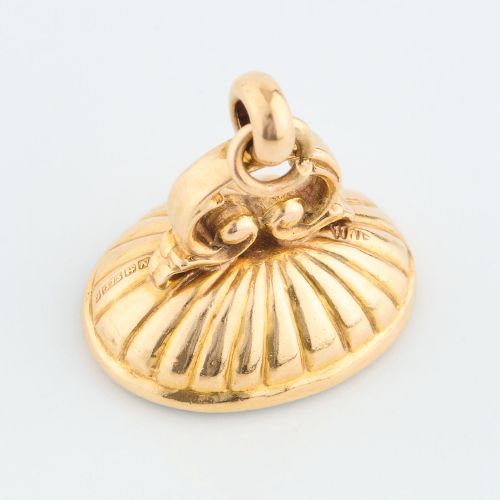 fig 2. An antique 9ct gold fob mount holding a polished oval green bloodstone with red flecks, featuring fluted rim detail and an arched suspension bail.
