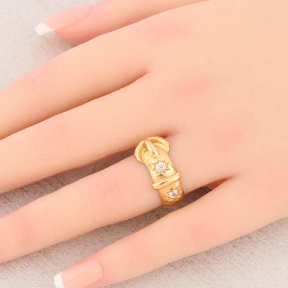 An 18ct yellow gold band shaped as a belt buckle with two star-set diamond accents. View II