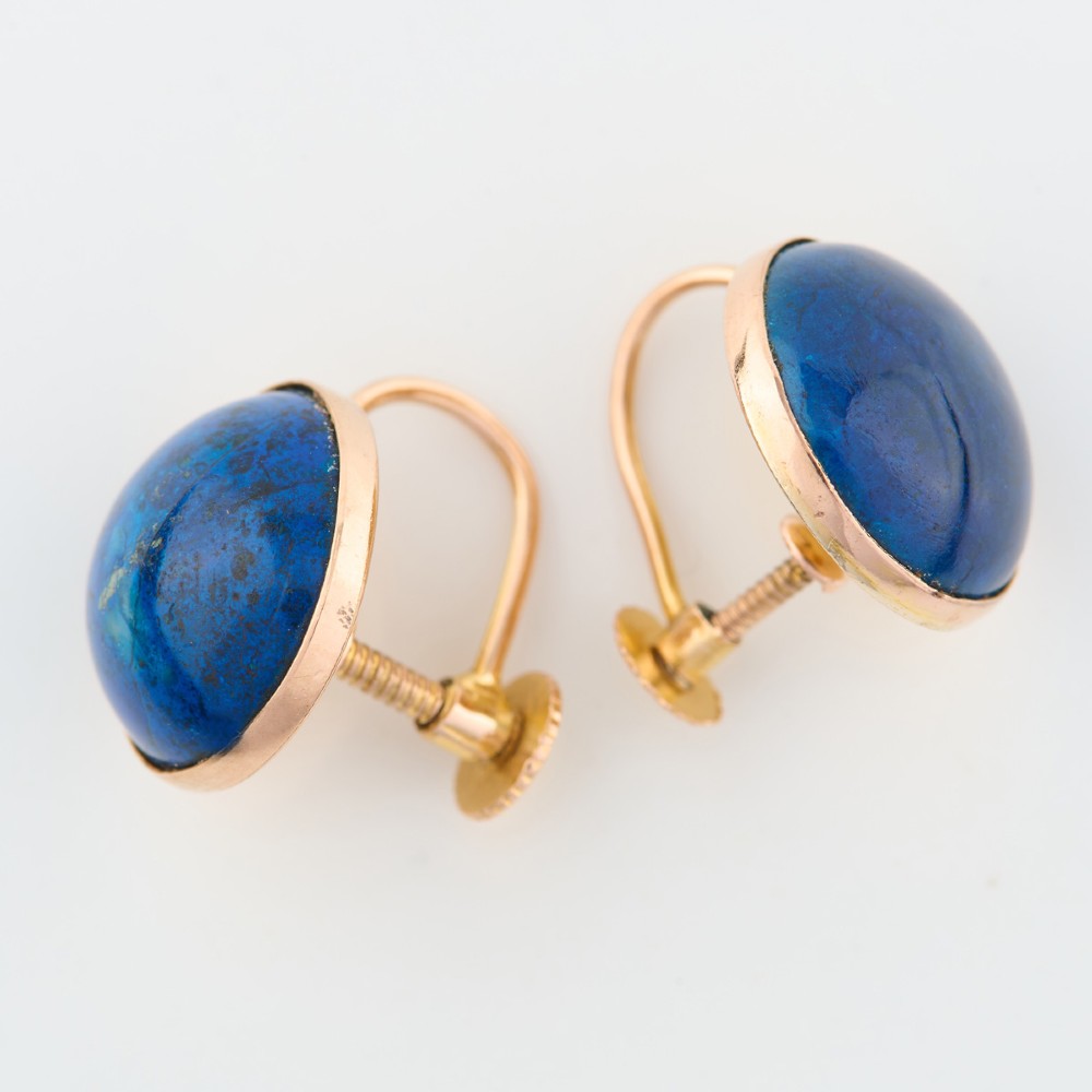 A pair of round 9ct yellow gold screw-back earrings set with polished deep blue lapis lazuli cabochon gemstones. View III