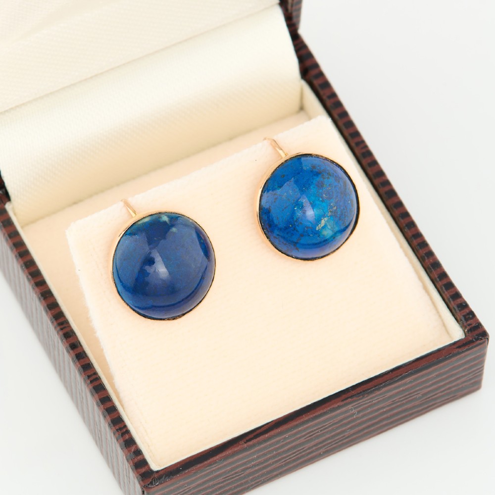 A pair of round 9ct yellow gold screw-back earrings set with polished deep blue lapis lazuli cabochon gemstones. View VIII