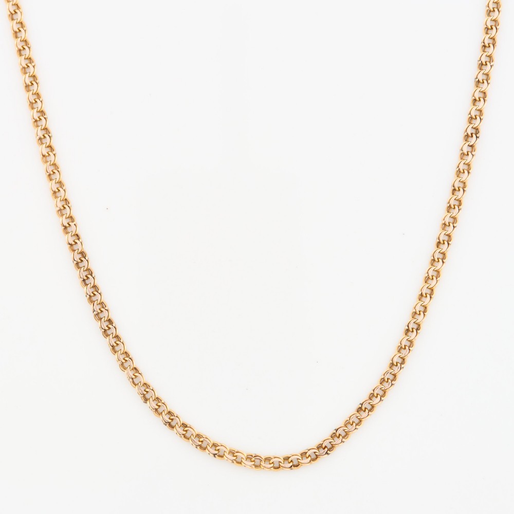 A close-up view of a 9ct gold double belcher chain necklace draped against a white background. View IV