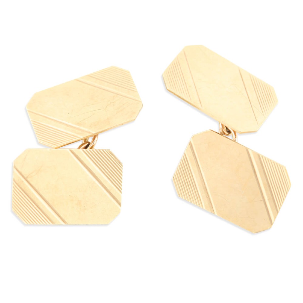 A pair of 9ct yellow gold octagonal chain cufflinks featuring engine-turned diagonal line engraving on polished panels.
