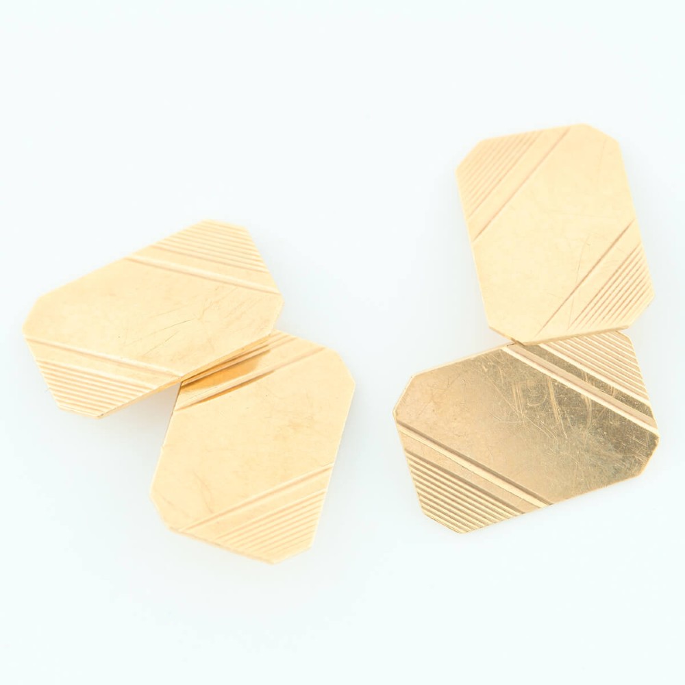 A pair of 9ct yellow gold octagonal chain cufflinks featuring engine-turned diagonal line engraving on polished panels. View III