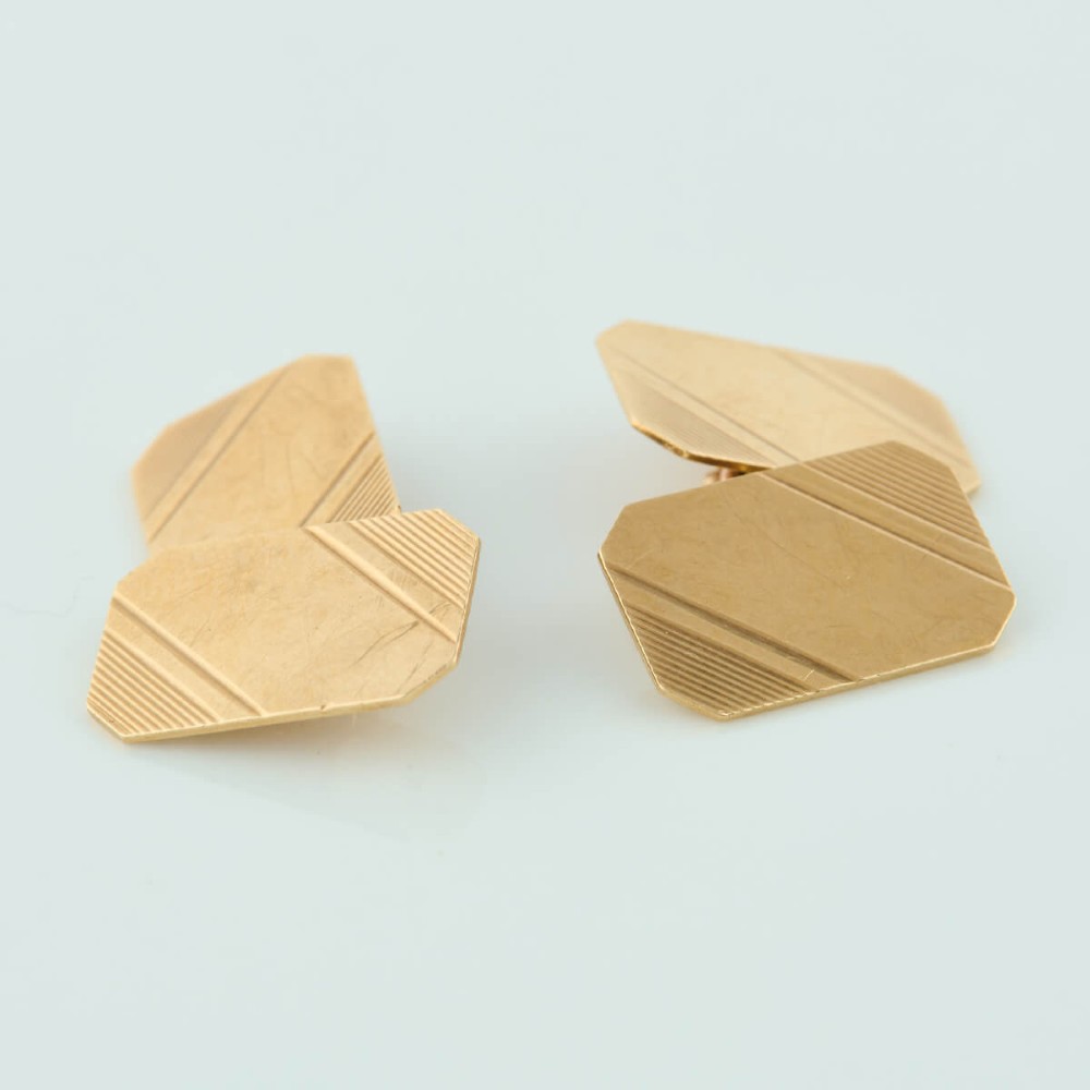 A pair of 9ct yellow gold octagonal chain cufflinks featuring engine-turned diagonal line engraving on polished panels. View IV