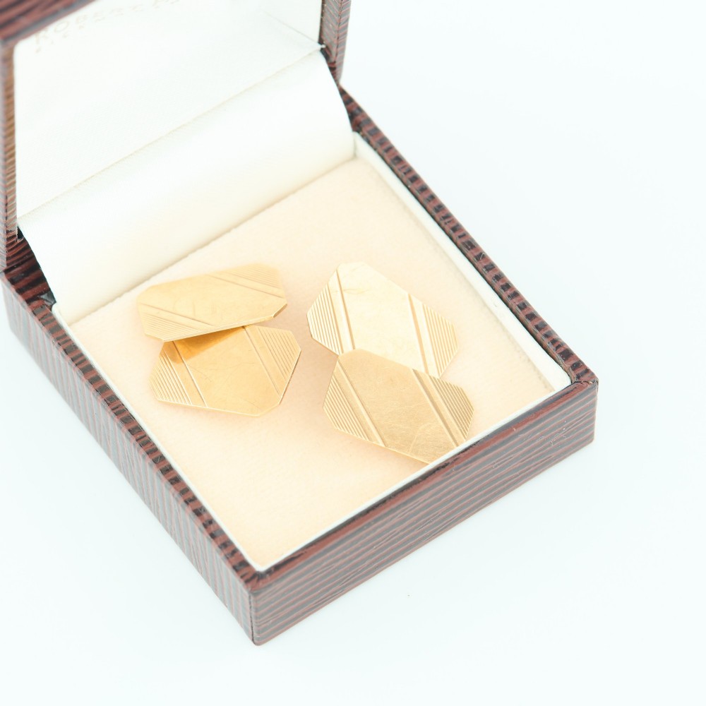 A pair of 9ct yellow gold octagonal chain cufflinks featuring engine-turned diagonal line engraving on polished panels. View VII