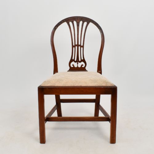 fig 1. An 18th-century mahogany dining chair featuring an arched back with carved splat, square legs, structural stretchers, and a patterned cloth seat.