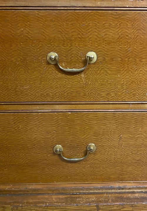 fig 3. A 19th-century two-door wooden wardrobe featuring scumble faux oak paintwork, a moulded top cornice, double panelled doors, and a solid plinth base.