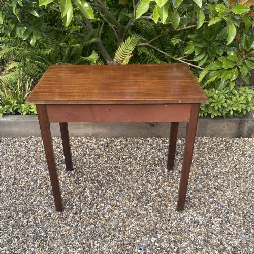 fig 3. An 18th-century Georgian mahogany side table featuring a single drawer with two brass swan-neck handles and square legs.