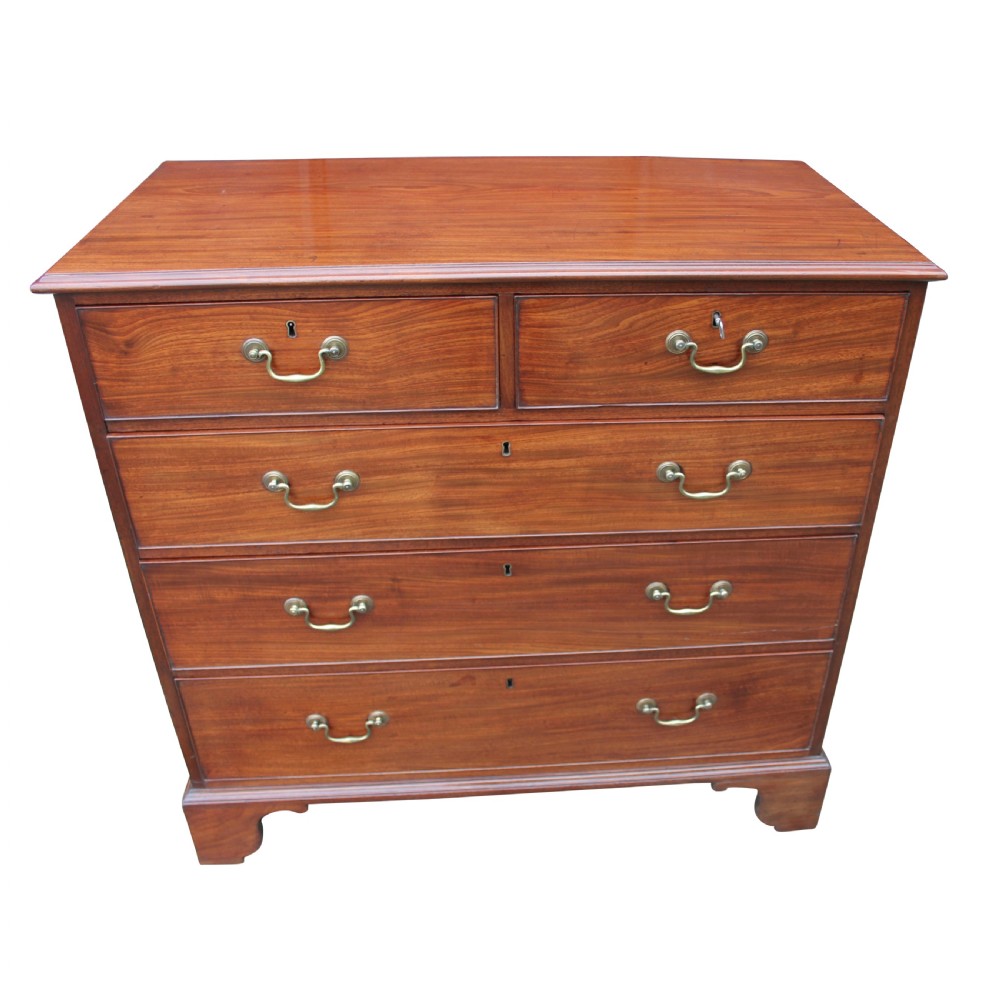 A freestanding Georgian solid mahogany chest of drawers featuring two upper small drawers over three graduating long drawers fitted with brass swan neck handles. View II